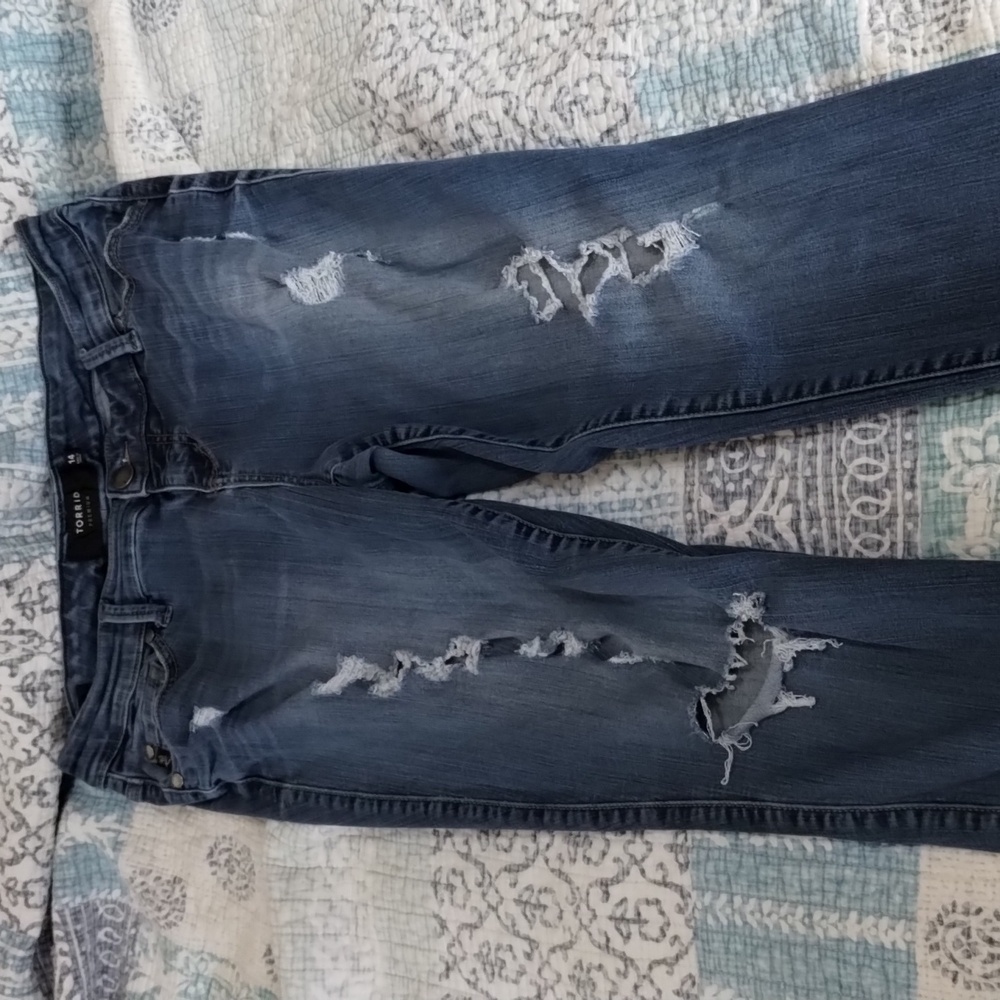 Torrid Size 14 ultra skinny jeans with designer destruction in legs.